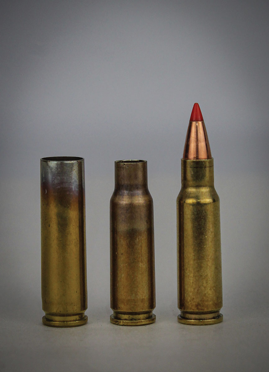 A 30 Carbine case (left) after passing through the AMP annealer, a 22 Spitfire case (center) after passing through the sizing die and a loaded 22 Spitfire round (right).